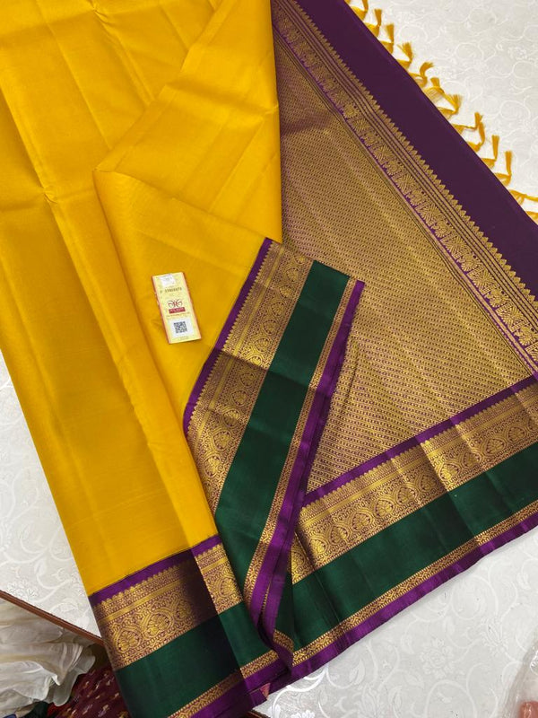 Yellow Kanchipuram Silk Saree with Retta Pettu Border