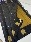 Trendy Elephant Border Design Black Handloom Kanchipuram Silk Saree with Zari Stripes along with Golden & Silver Zari Butta