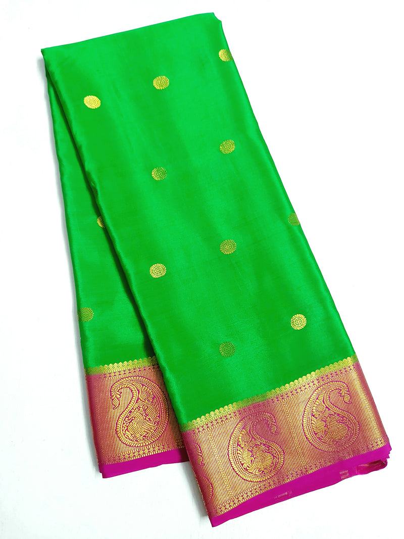 Apple Green Mysore Silk Saree accentuated with contrast zari border & pallu  of zari strip designs