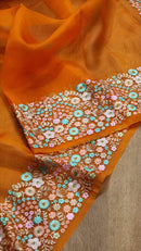 Orange Organza Saree With Multi Floral Embroidery Border & Special Tassels