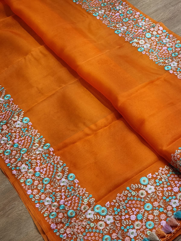 Orange Organza Saree With Multi Floral Embroidery Border & Special Tassels
