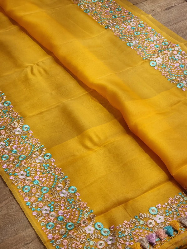 Yellow Organza Saree With Multi Floral Embroidery Border & Special Tassels