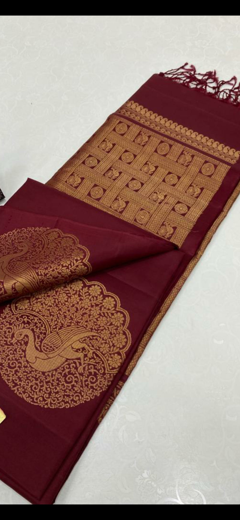 Borderless Maroon Soft Silk Saree with Unique Peacock Butta